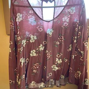 Cute floral moc neck blouse has free flowing arms